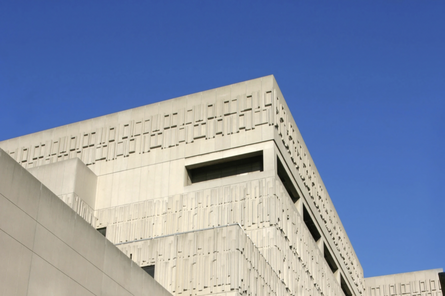 The roofline of the Medical Sciences Building with a clear blue sky in the background.